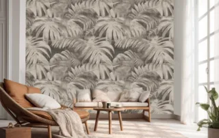A relaxing window area with flowing cream-colored curtains, a thin matching carpet, a small wooden couch, and a seat, with a very light greenish Boho fern wallpaper in the background.